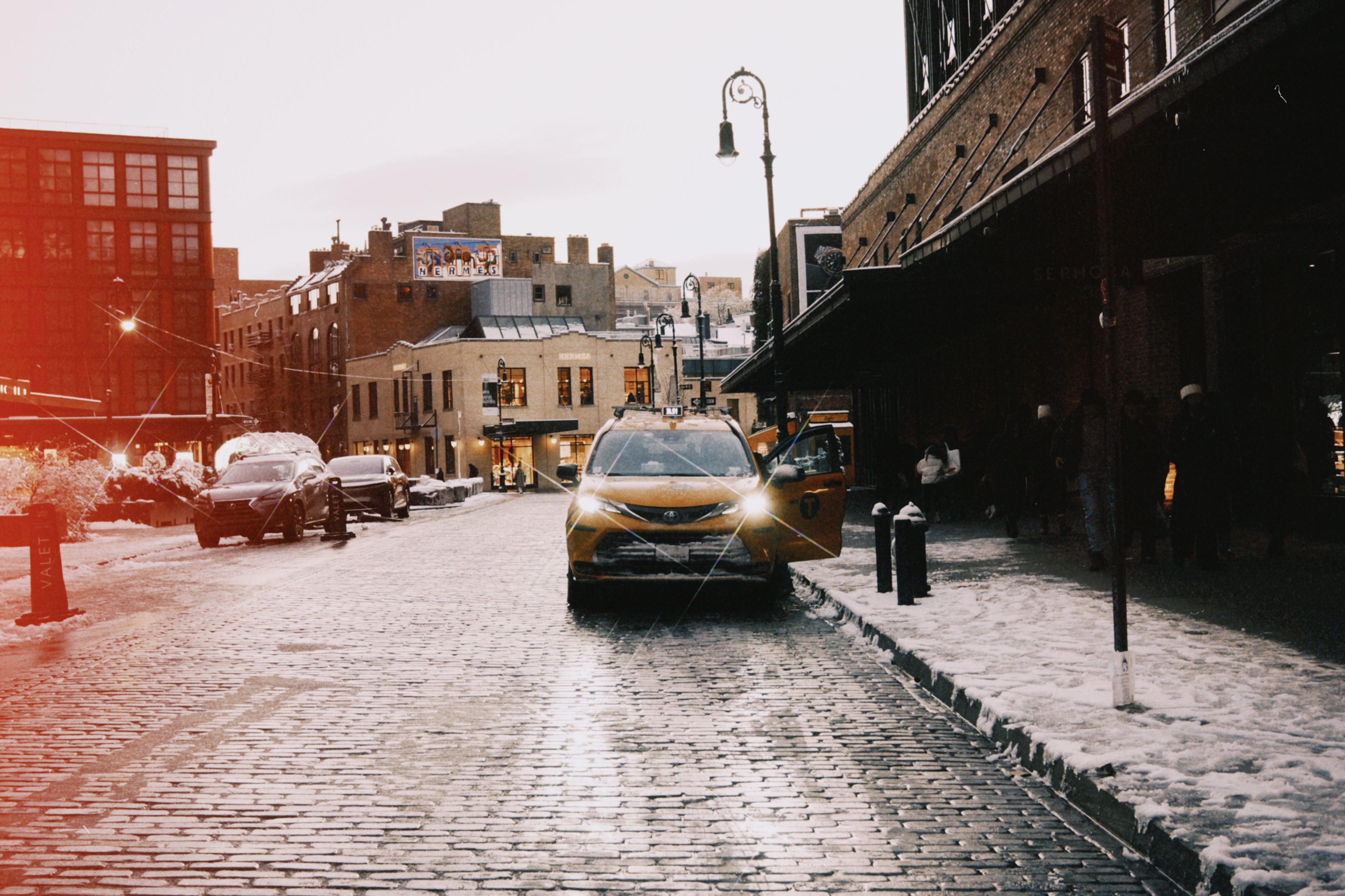 NYC cobblestone taxi snow